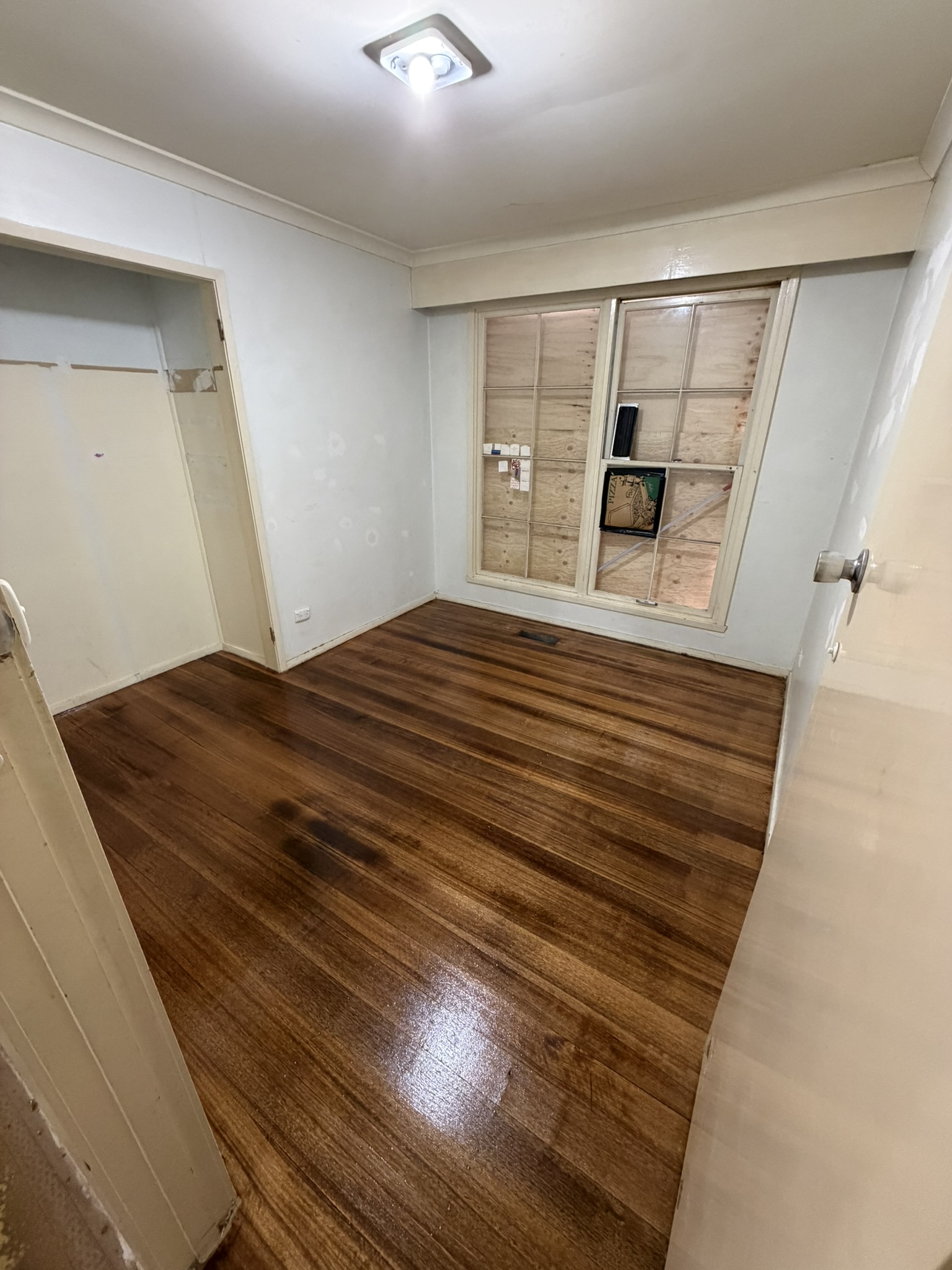 Bedroom floor restoration after sanding and polishing