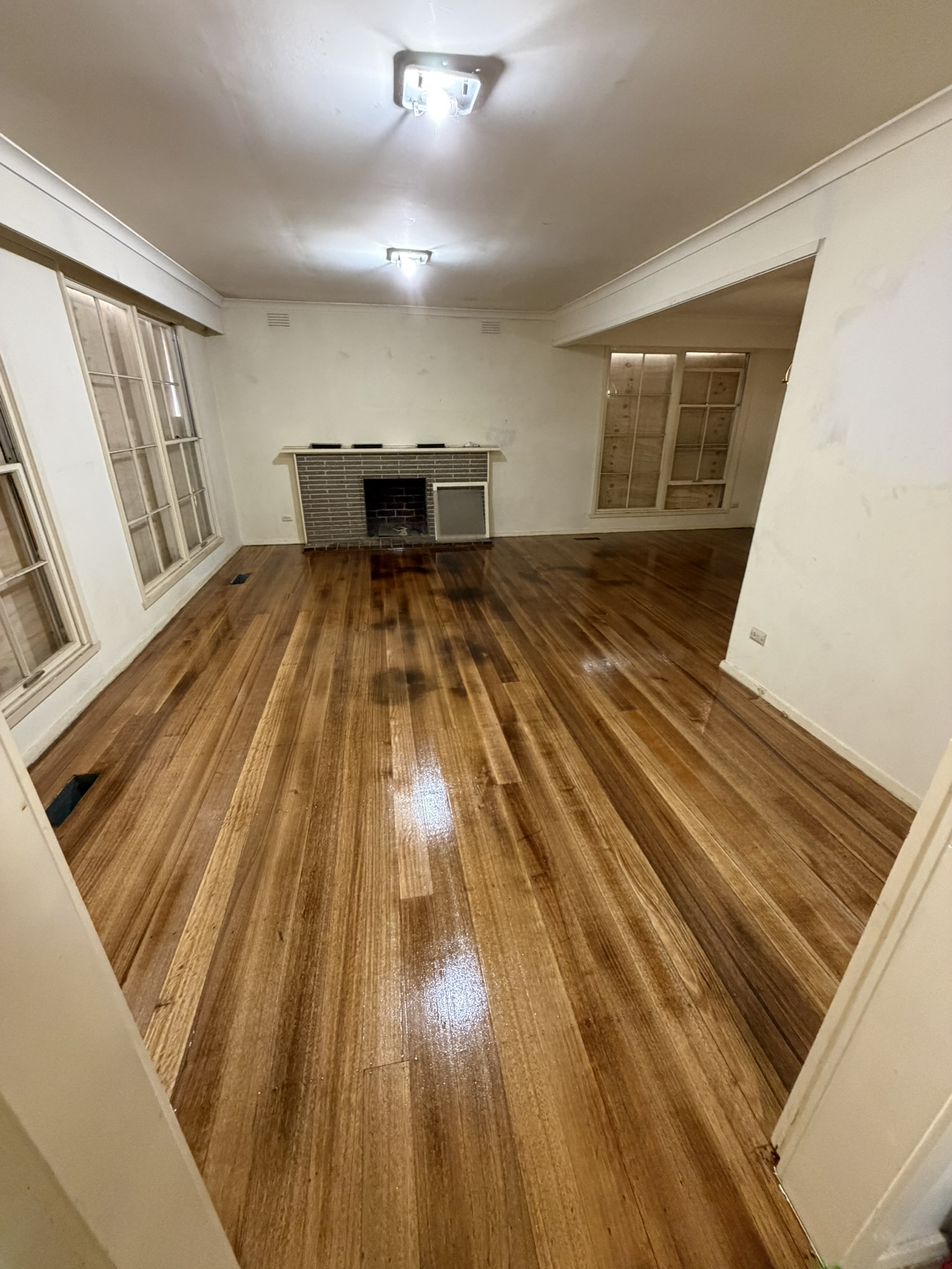 Living room floor restoration after sanding and polishing